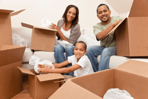 family unpacking in their hew home